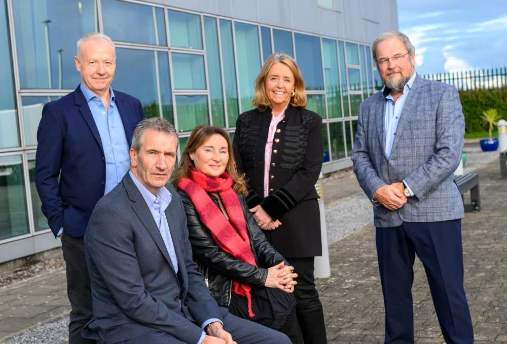 Men and women outside a building in Cork.
