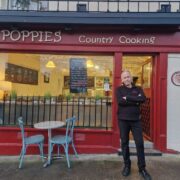 Man standing outside a cafe in Wicklow, Ireland.