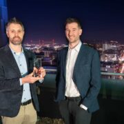 Two men with an award in Belfast.