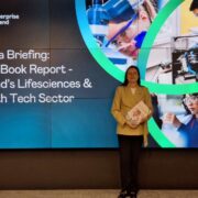 Woman holding a report.