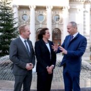 Two men and a woman at Government buildings in Dublin.