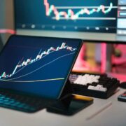 Close-up of computers running financial software.