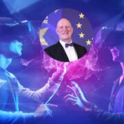 Man in suit inset on image of two people using virtual reality headsets.