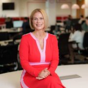Woman in red and pink dress.
