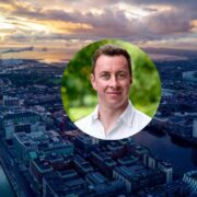 Man inset on aerial view of Dublin city.