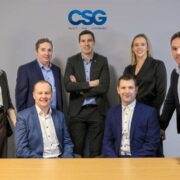 Group of accountants announcing a merger.