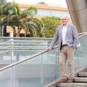 Man in blue sports jacket in Trinidad.