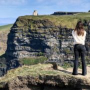 Woman standing at an Irish cliff.