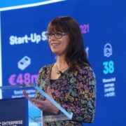 Woman speaking at a podium.