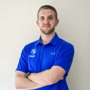 Man wearing blue polo shirt.