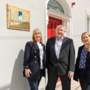 Man and two women outside Newbridge Business Centre.