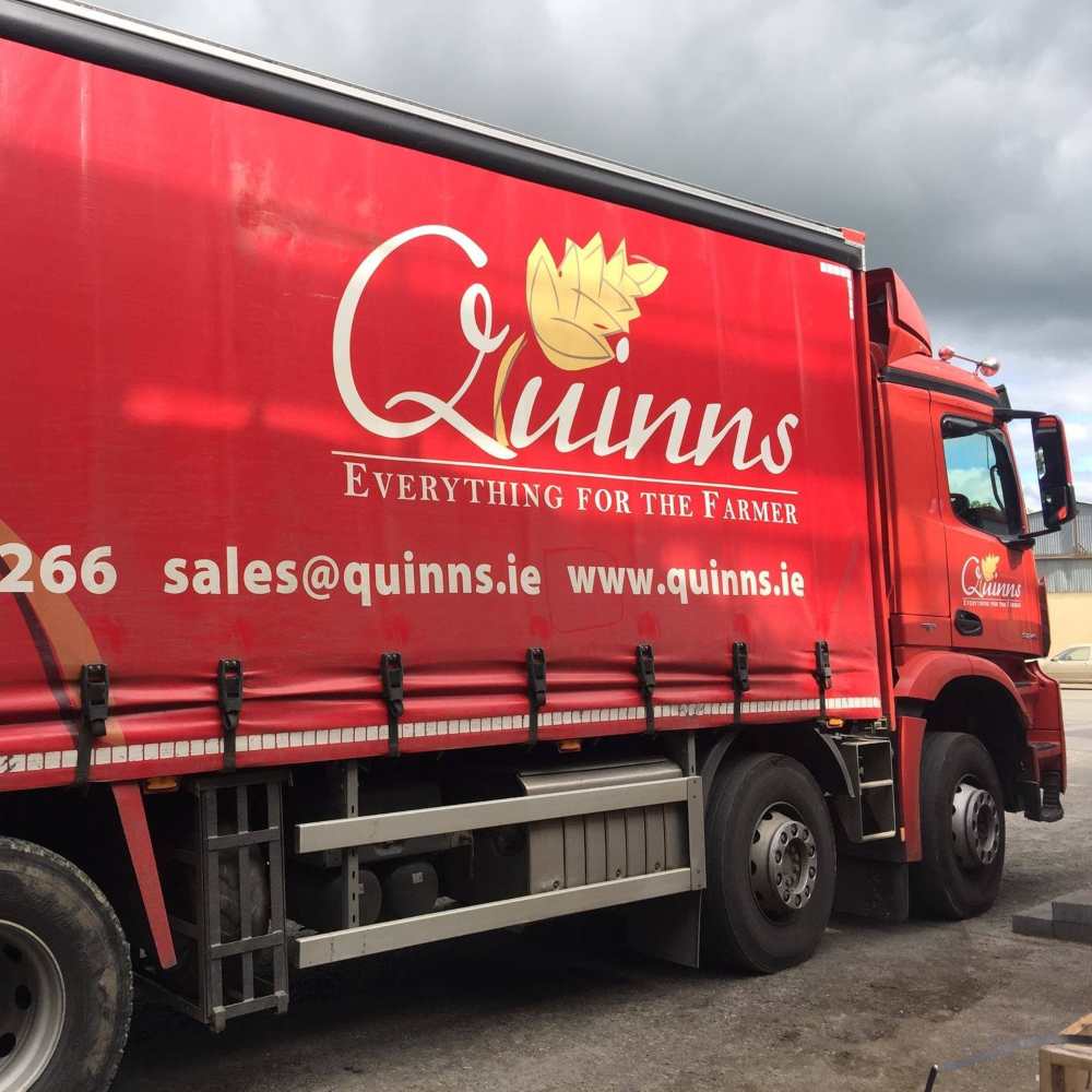 Quinn's of Baltinglass truck with red paneling.