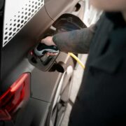 Man charging an electric car.