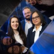 Three Bank of Ireland colleagues inside computer screens.