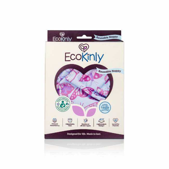 Packaging of an EcoKinly reusable nappy showing a heart‑shaped window displaying a pink and purple patterned cloth nappy, with icons highlighting absorbency, adjustable fit, gentle on skin and lightweight design.