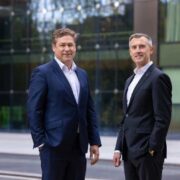 Two men in dark suits.