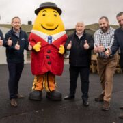 Five men and a Mr Tayto mascot.