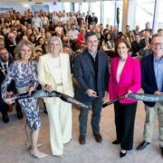 Group of Datavant staff and invited guests gathered inside the Bonham Quay office in Galway, standing in front of a seated audience while cutting a branded Datavant ribbon to mark the opening of the company&rsquo;s Global R&D Centre.