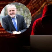 Portrait-style composite image showing a hooded figure using a laptop against a red background filled with binary code, alongside a circular inset photo of a suited business professional, illustrating cybersecurity threats and leadership context.