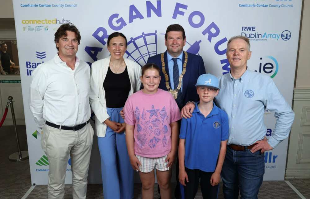 Group photo at the Dargan Forum 2026 featuring six attendees standing in front of a branded event backdrop displaying logos for Connected Hubs, RWE Dublin Array, Bank of Ireland and .ie, with Dún Laoghaire-Rathdown County Council branding visible.