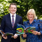 Representatives reviewing tourism strategy publications at a Fáilte Ireland event, highlighting plans for growth, tourism development and the future of Ireland’s hospitality sector.