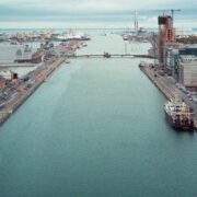 ublin Docklands waterfront with office developments, construction projects and port facilities reflecting investment and economic growth in Ireland.