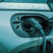 Electric vehicle charging cable connected to a battery electric car in Ireland as EV registrations reach record highs and become the country's leading vehicle type.