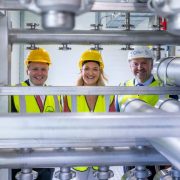 Officials and industry representatives wearing safety helmets and high-visibility vests at College Group’s €30m biomethane facility in Nobber, Co Meath, during the connection of the renewable gas plant to Ireland’s national gas network by Gas Networks Ireland.
