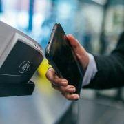 Contactless smartphone payment at a retail checkout terminal in Ireland.