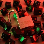 Padlock surrounded by computer keyboard keys, illustrating cybersecurity protection, data security and cyberattack prevention for small businesses and SMEs.