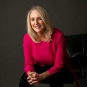 Portrait of Gourmet Food Parlour founder Lorraine Heskin seated against a dark studio background, featured in a ThinkBusiness podcast discussing the growth of the Irish hospitality and catering business to €20 million turnover.