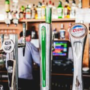 Draught beer taps inside an Irish pub bar, representing Ireland's hospitality industry amid rising pub closures and challenges facing rural public houses.