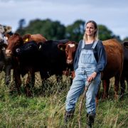 Cassie McCarthy with cattle at Lúnasa Farm in Mayo, showcasing organic livestock farming and sustainable food production.
