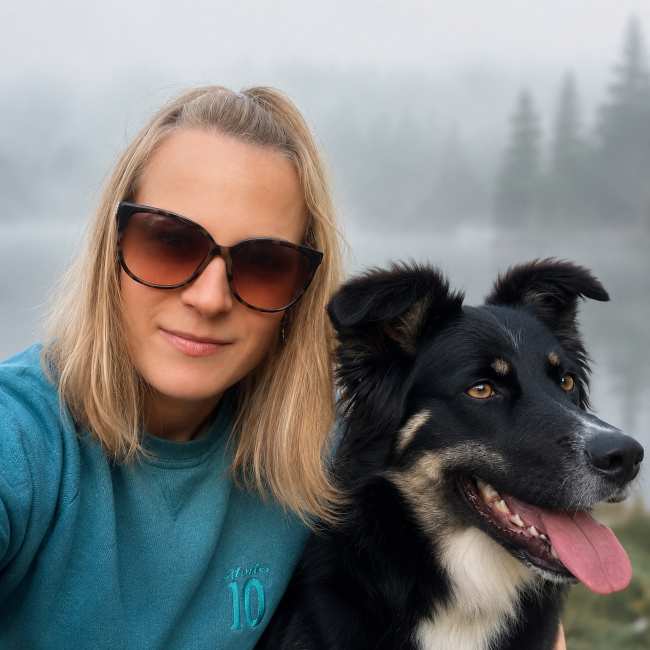 Agnes Stawosz of Dogville holding a small dog, highlighting the Cork-based luxury dog boarding, grooming and premium pet care business.