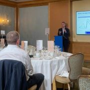Attendees at a Bank of Ireland Forecasting 2027 event listen to an economic outlook presentation covering interest rates, inflation, oil prices, currency markets and geopolitical risks facing Irish businesses.