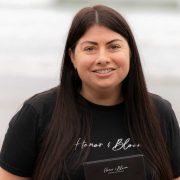 Honor & Bloom founder pictured holding branded packaging, highlighting the Irish floral gifting business and its personalised flower delivery service.