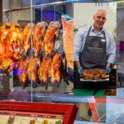 Roast ducks hanging in the window of a Chinese restaurant, with Silver Hill Duck representative holding a plated duck dish, highlighting premium Irish duck exports and international food markets.