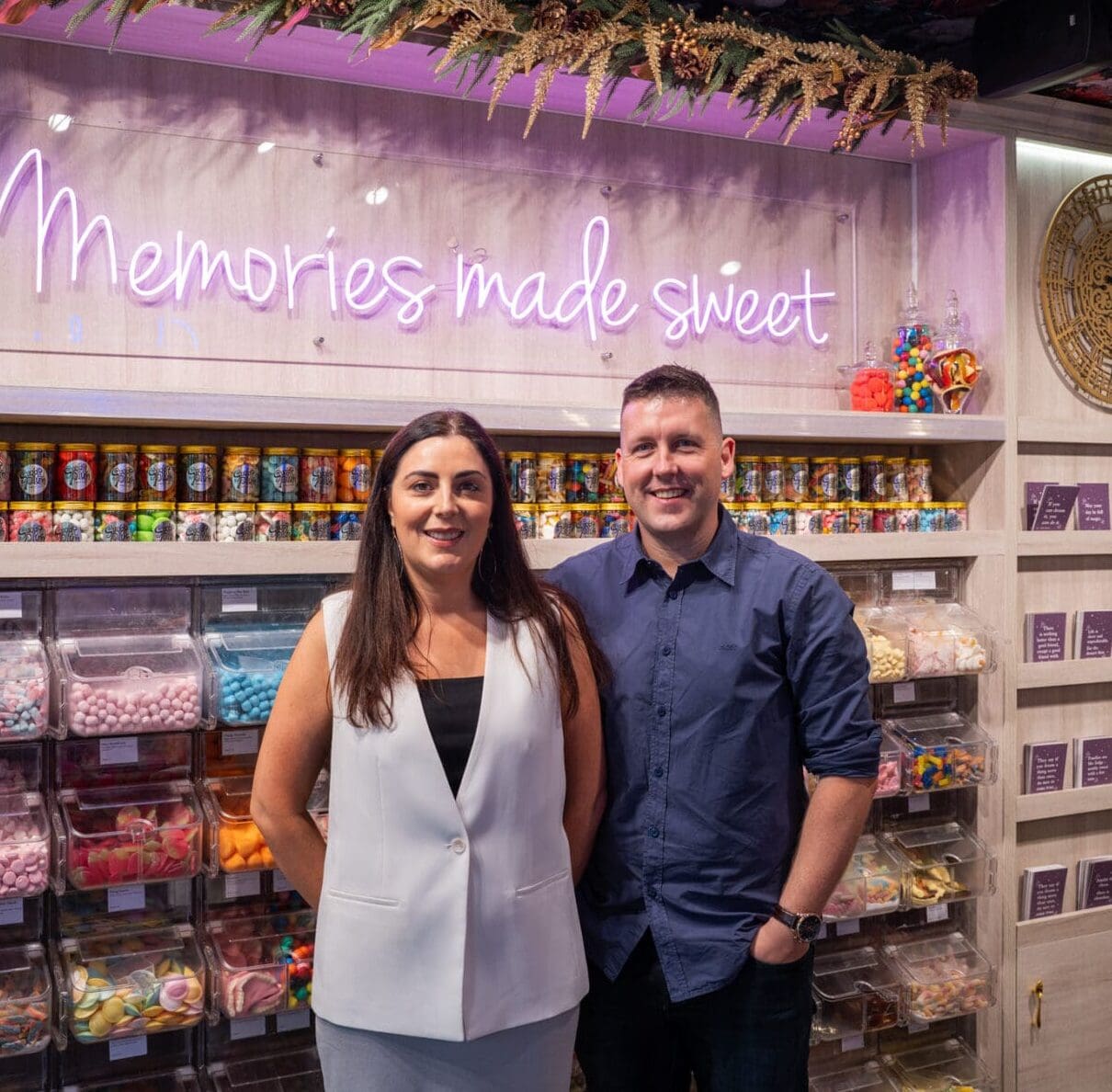 Man and woman in a sweet shop.