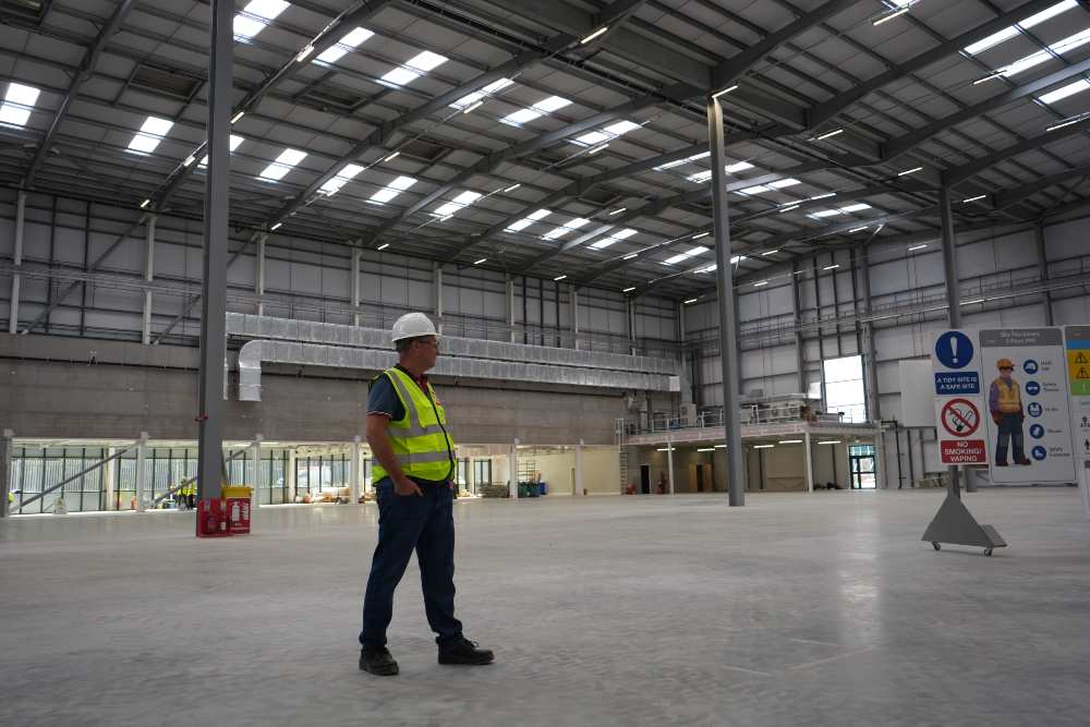 Worker in high-visibility safety gear inside RS Ireland’s new industrial warehouse at Apex Hub in Ballymount, Dublin.