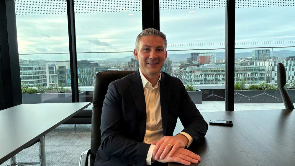 Business representative seated at a conference table in a modern Dublin office, accompanying an article on SME growth finance and business investment in Ireland.