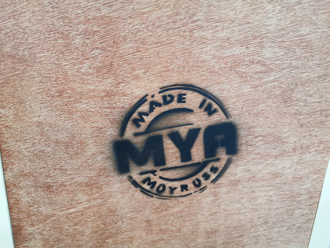 Made in Moyross stamped on a piece of wood.
