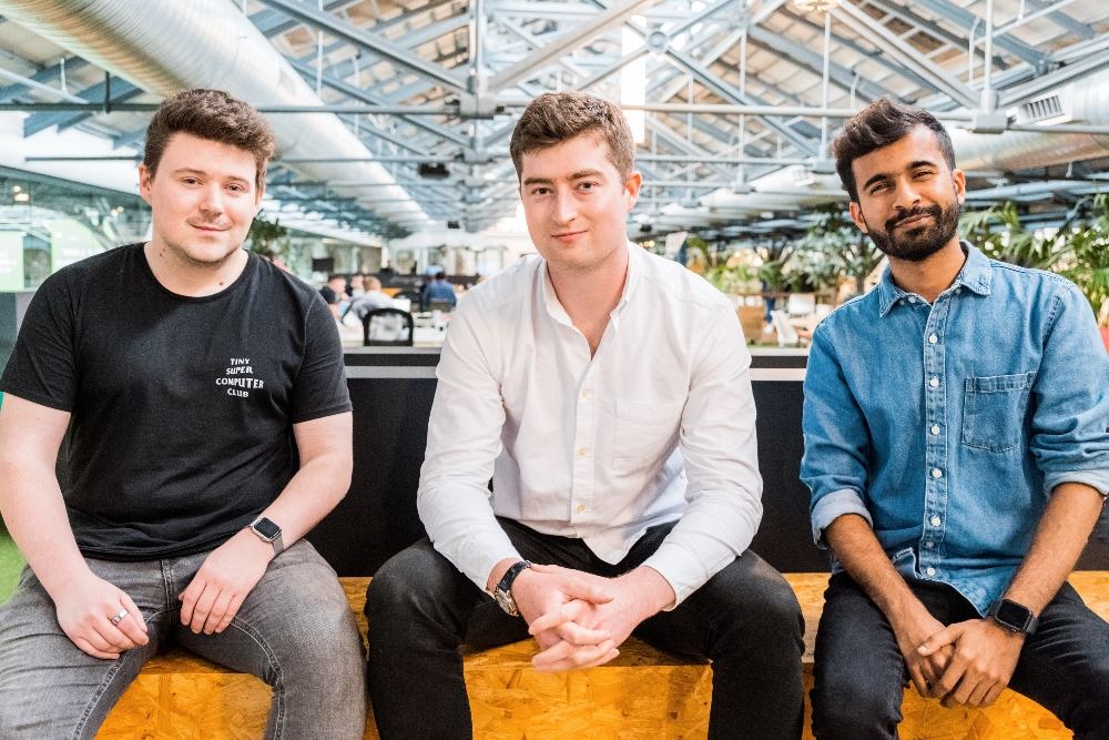 Three men on a bench.