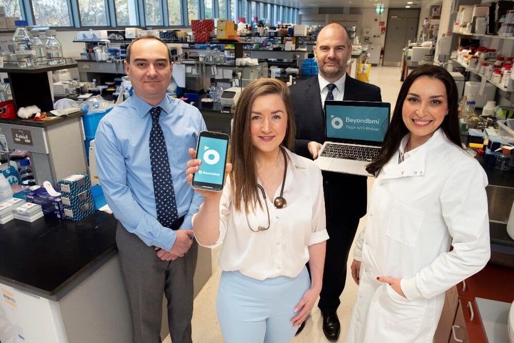 Two women and two men in a research lab.