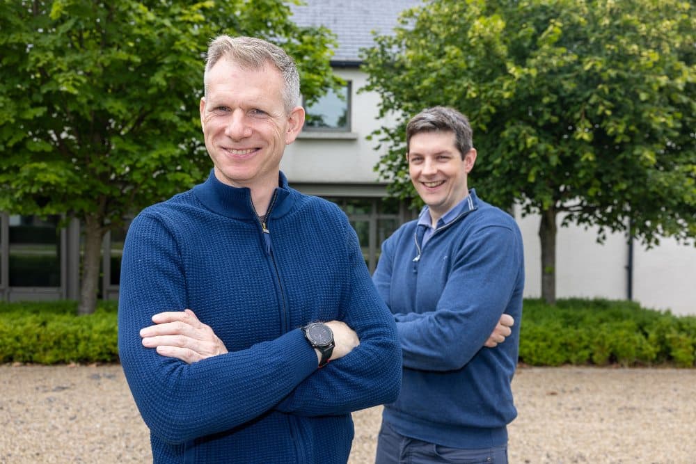 Two men dressed in blue.