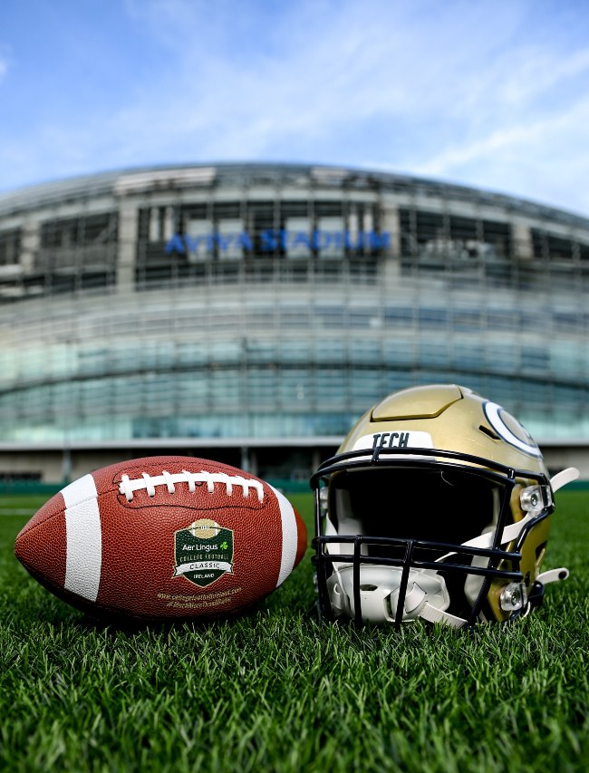American football and helmet in front of the Aviva Stadium in Dublin.