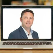 Man inset on image of a computer in the classroom.