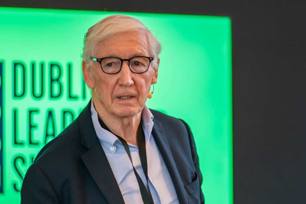 Man speaking at conference.