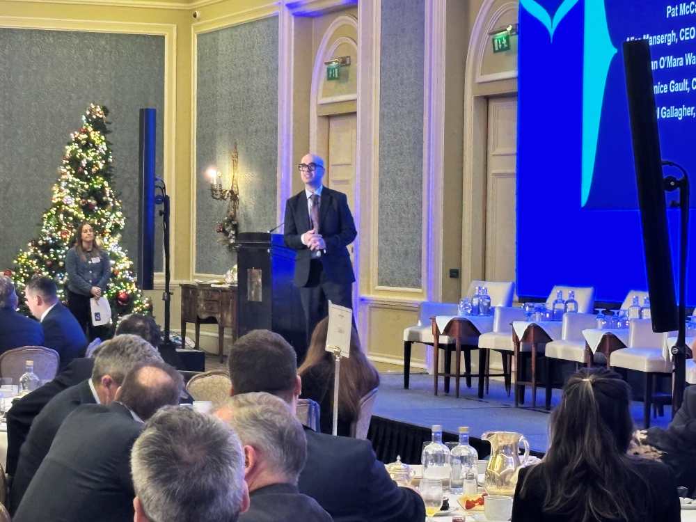 Man speaking at a podium.